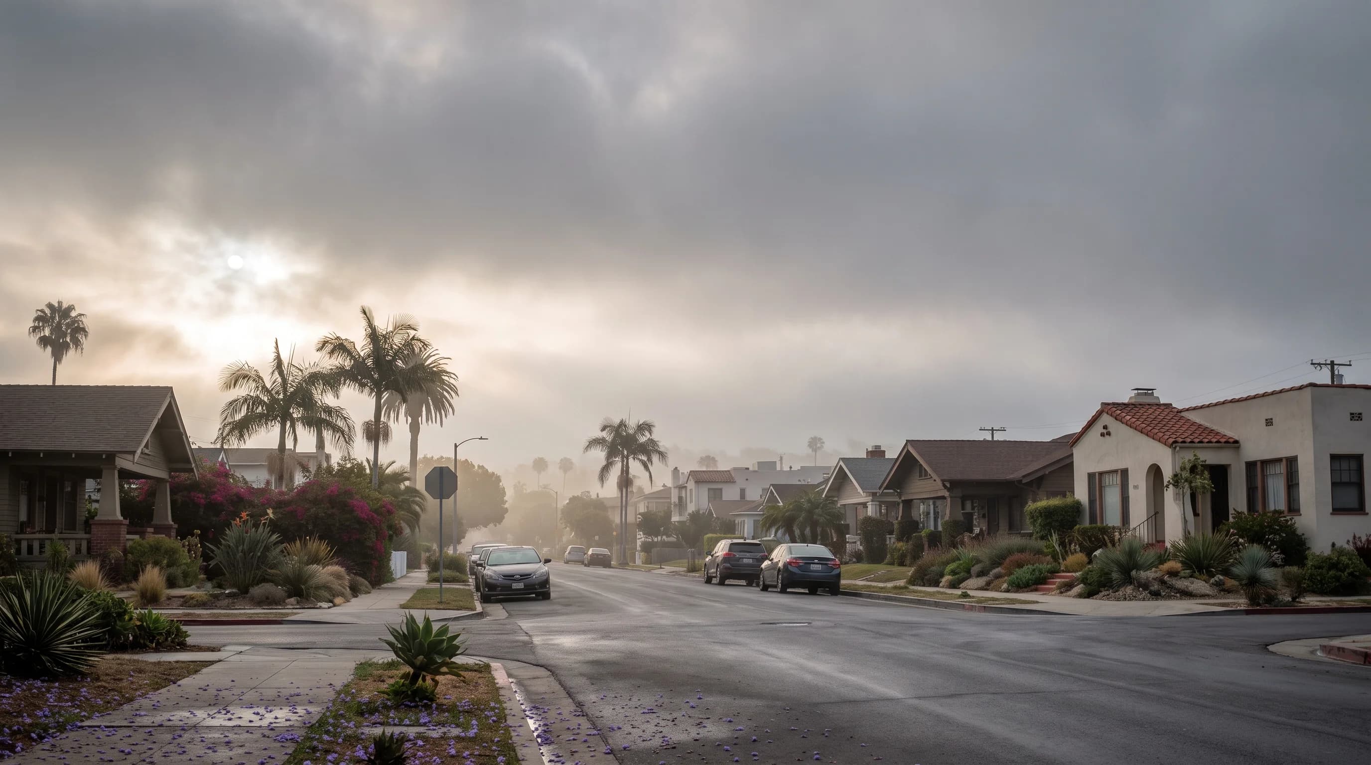 A late-spring Los Angeles morning split naturally between gray coastal neighborhoods and a sunlit inland valley beyond the marine cloud edge
